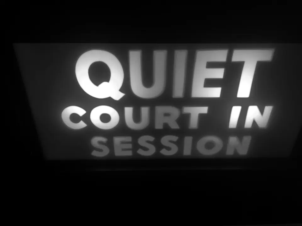 Illuminated sign reading Quiet, Court in Session