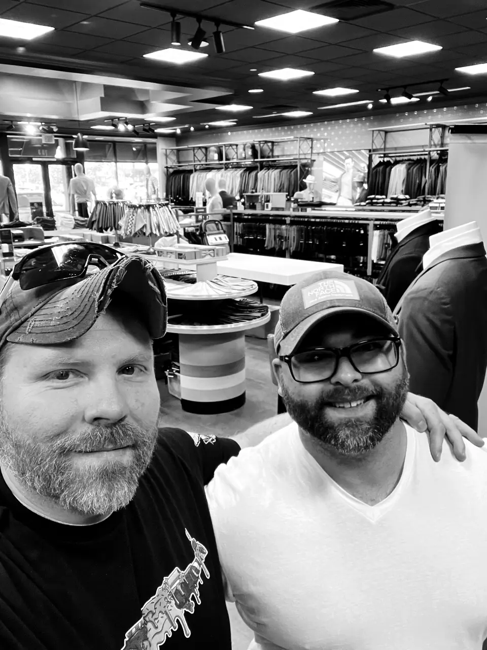 Craig Smith with John Lott: selfie in a clothing store