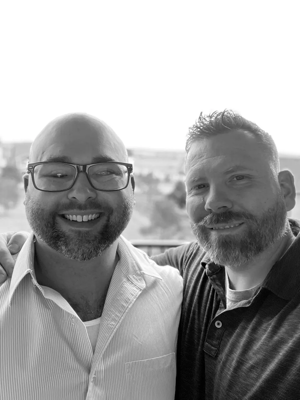 Craig Smith with John Lott: selfie on a balcony